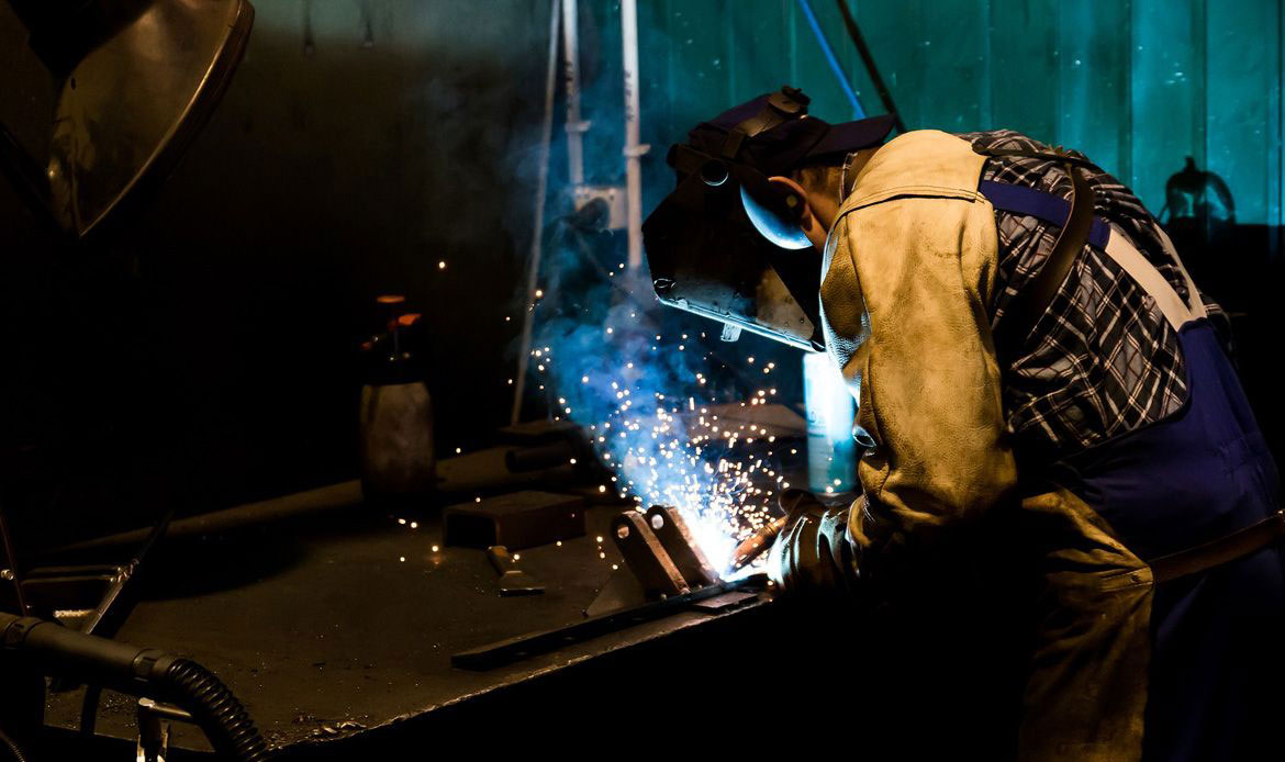 Man working as a welder