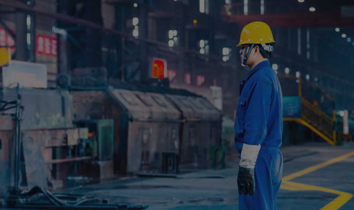 Man in labor uniform looking to the equipments