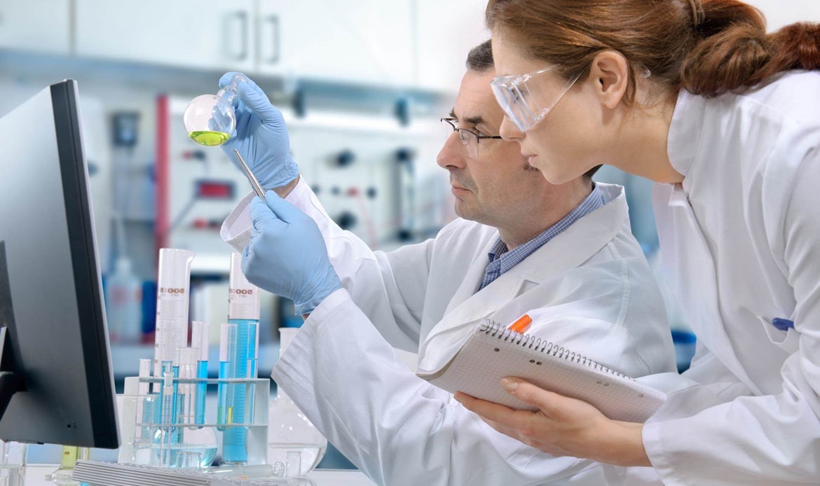 Man and woman working in a chemical laboratory